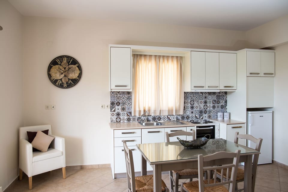 Apartment, 2 Bedrooms | Private kitchenette | Fridge, stovetop, electric kettle, cookware/dishes/utensils
