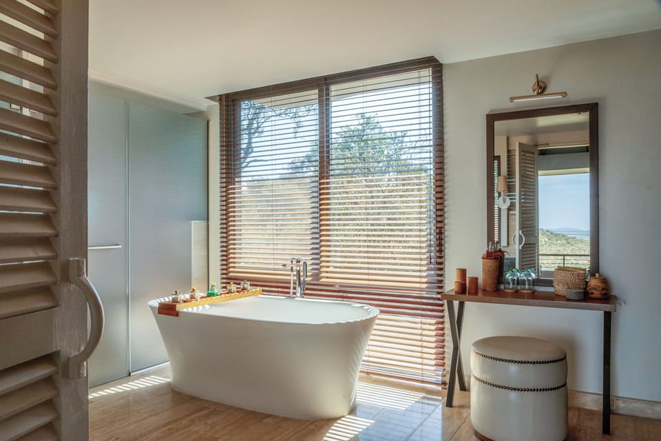 Separate tub and shower, deep soaking tub, designer toiletries