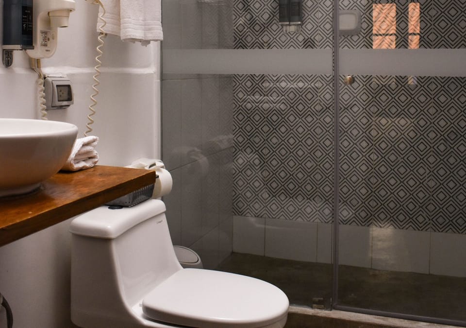Superior Double Room | Bathroom | Shower, rainfall showerhead, towels, soap