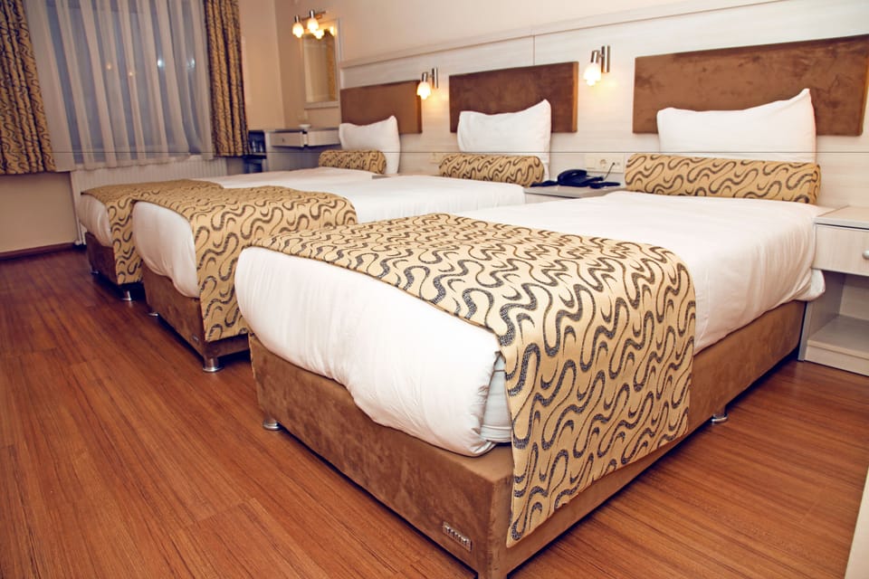 Premium bedding, free minibar items, desk, soundproofing