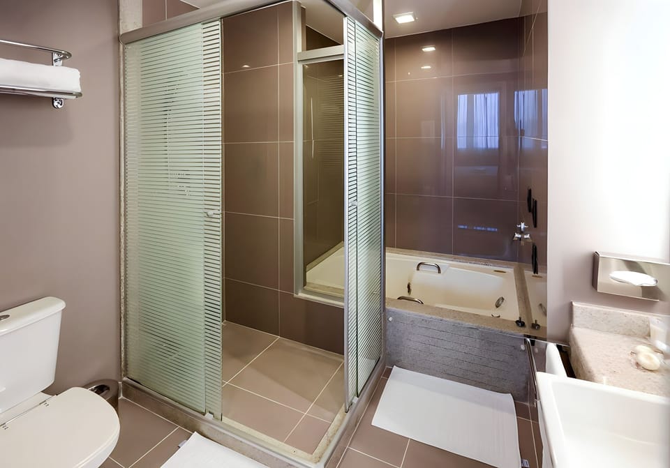Suite, 1 King Bed | Bathroom | Shower, eco-friendly toiletries, hair dryer, towels