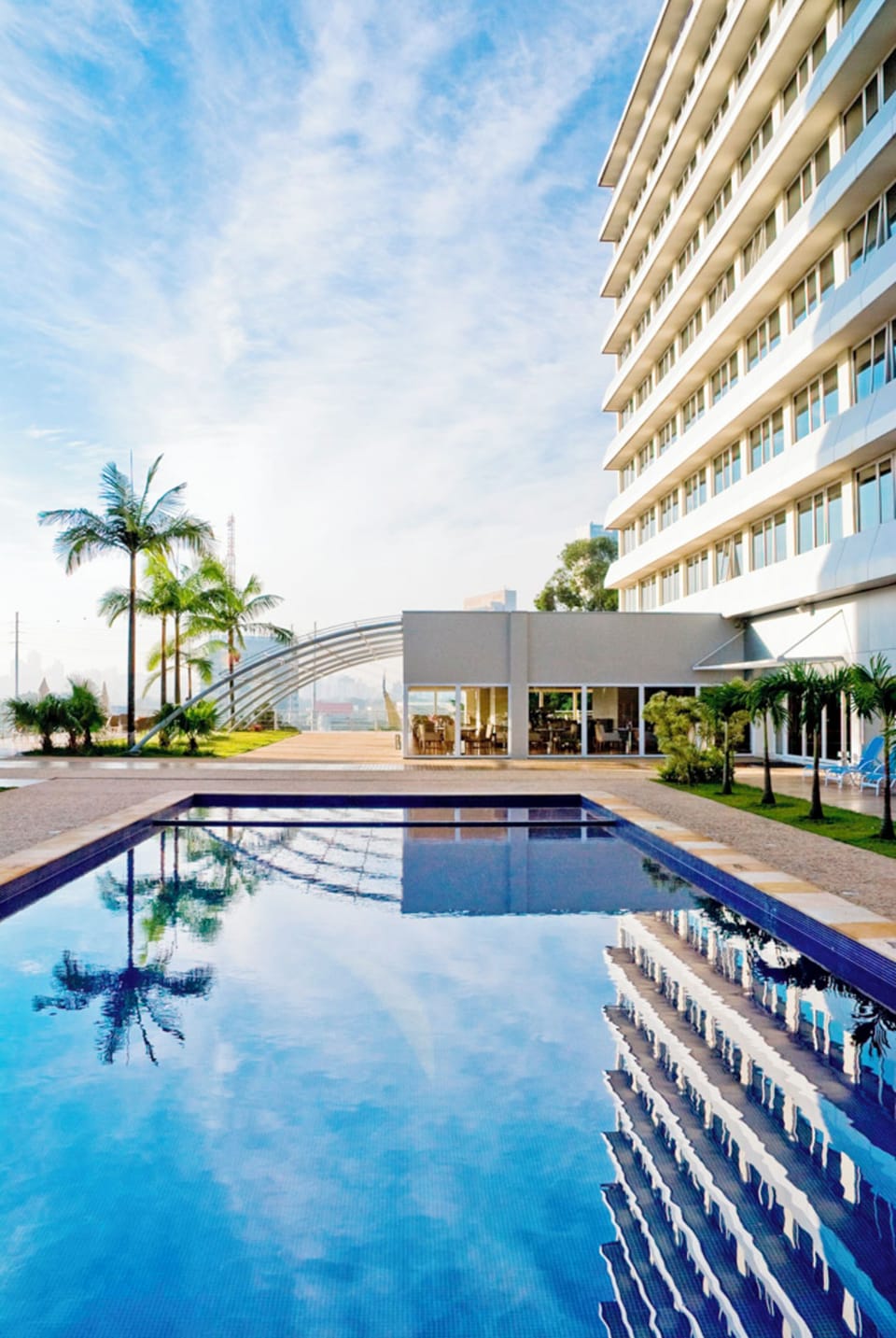 Outdoor pool, open 6:00 AM to 10:00 PM, pool umbrellas, sun loungers