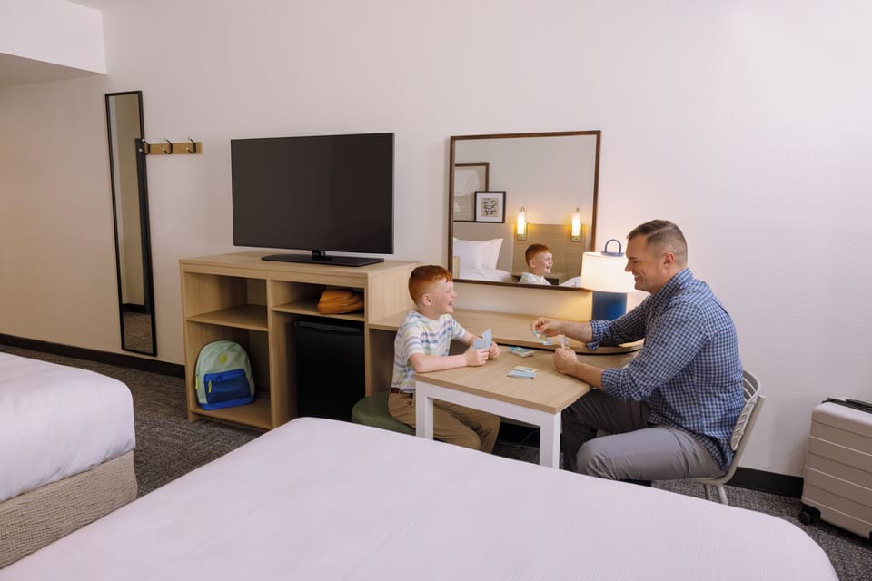 Room, 2 Queen Beds | In-room safe, desk, laptop workspace, blackout drapes