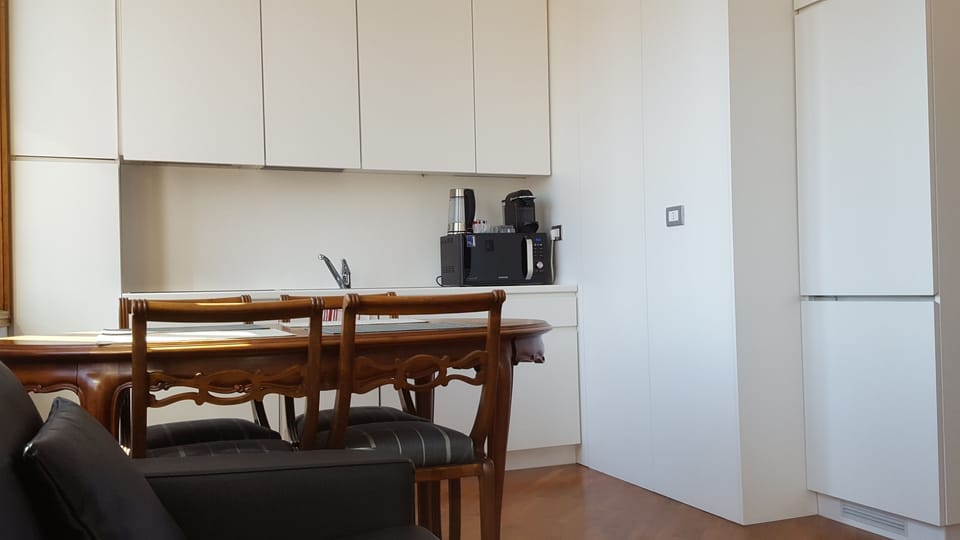 Studio, City View | Private kitchen | Full-size fridge, microwave, oven, stovetop