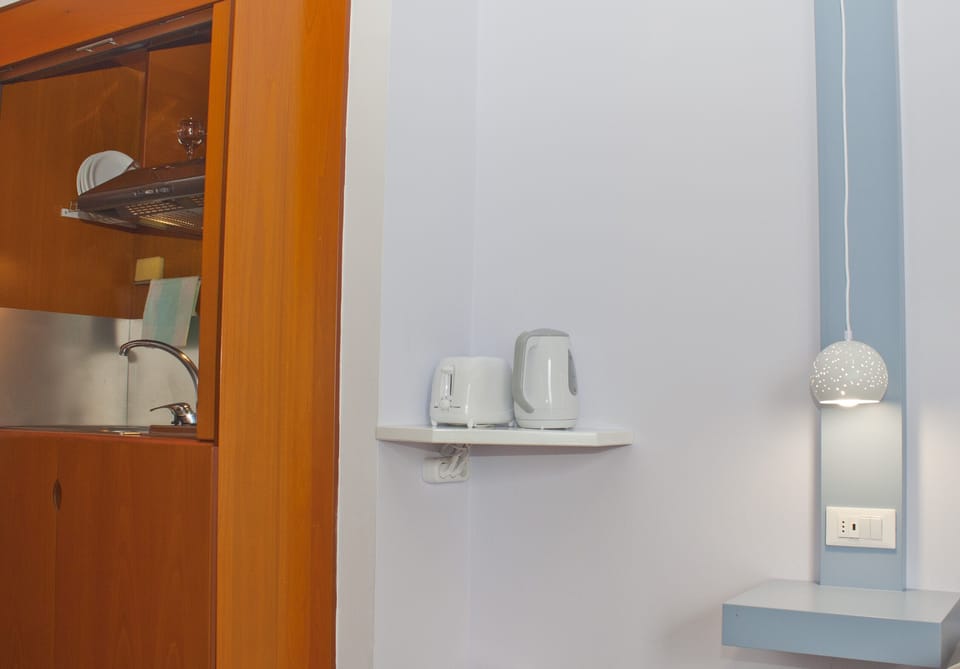 Basic Studio, 1 Bedroom, Beachfront | Pillowtop beds, in-room safe, soundproofing, iron/ironing board