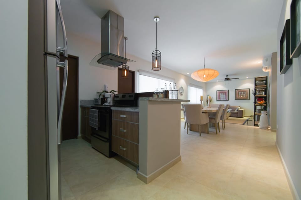 Deluxe Condo, 2 Bedrooms, Terrace, Pool View | Private kitchen | Full-size fridge, microwave, stovetop, coffee/tea maker