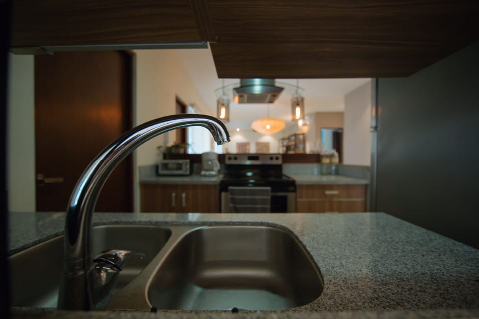 Deluxe Condo, 2 Bedrooms, Terrace, Pool View | Private kitchen | Full-size fridge, microwave, stovetop, coffee/tea maker