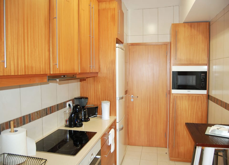 Comfort Apartment | Private kitchen | Full-size fridge, microwave, oven, stovetop