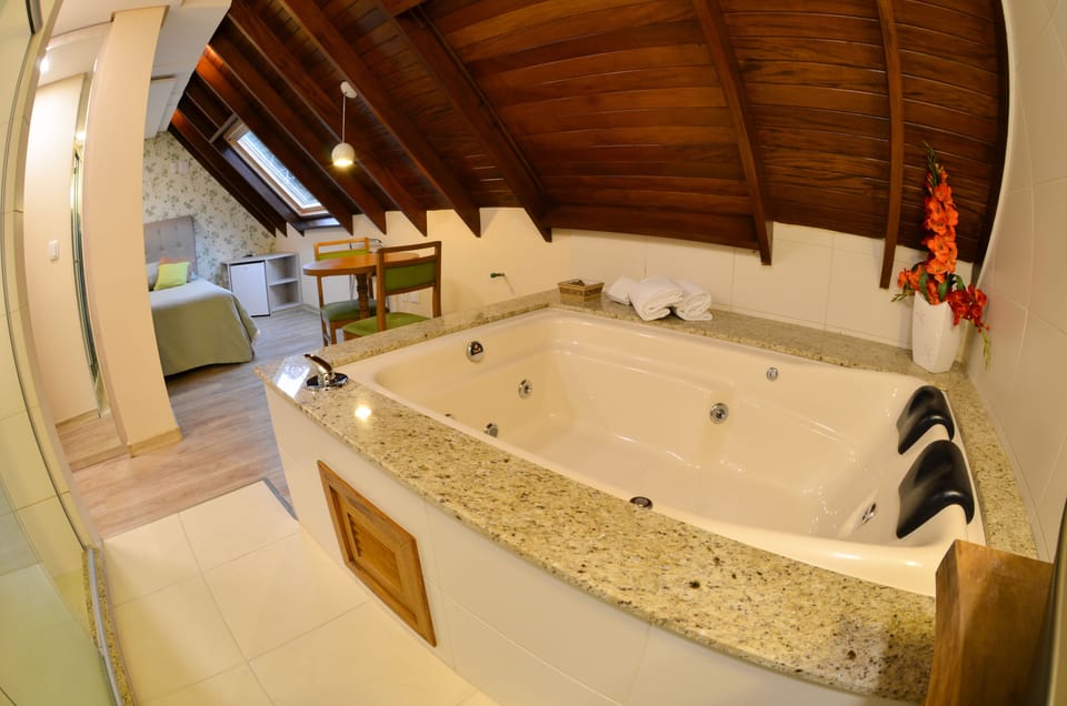 Deluxe Suite, Jetted Tub | Minibar, in-room safe, desk, soundproofing