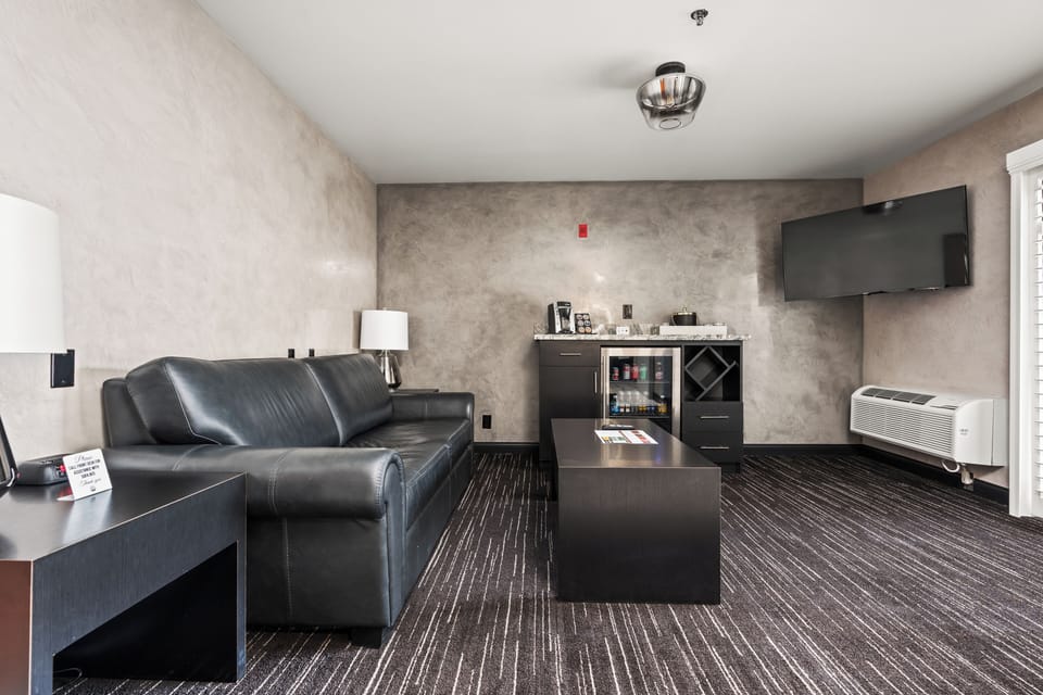 Suite, 1 King Bed, Balcony | Living area | 43-inch flat-screen TV with cable channels, TV