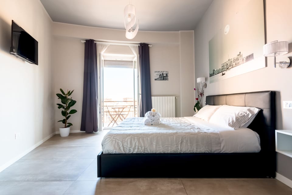 Deluxe Double Room, Balcony, Partial Sea View | Frette Italian sheets, premium bedding, down comforters, pillowtop beds