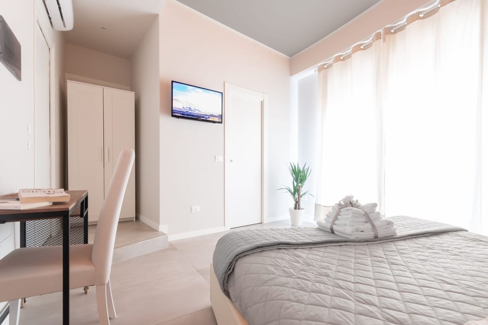 Deluxe Double Room, Balcony, Partial Sea View | Frette Italian sheets, premium bedding, down comforters, pillowtop beds