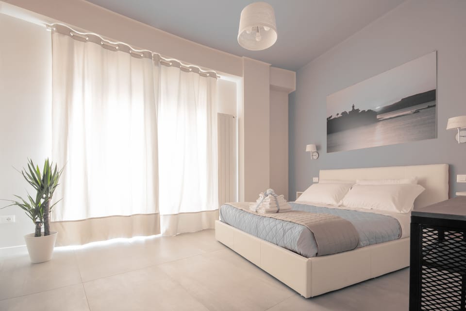 Deluxe Double Room, Balcony, Partial Sea View | Frette Italian sheets, premium bedding, down comforters, pillowtop beds