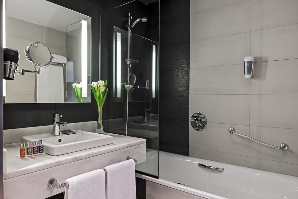 Eco-friendly toiletries, hair dryer, bidet, towels