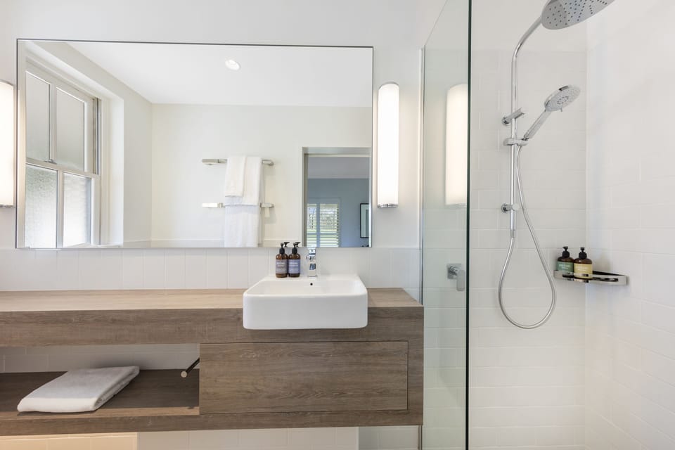 Shower, rainfall showerhead, designer toiletries, hair dryer
