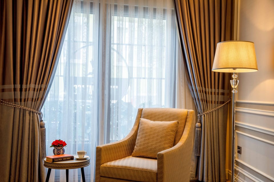 Deluxe Suite | Living room | 52-inch LCD TV with cable channels, TV, heated floors