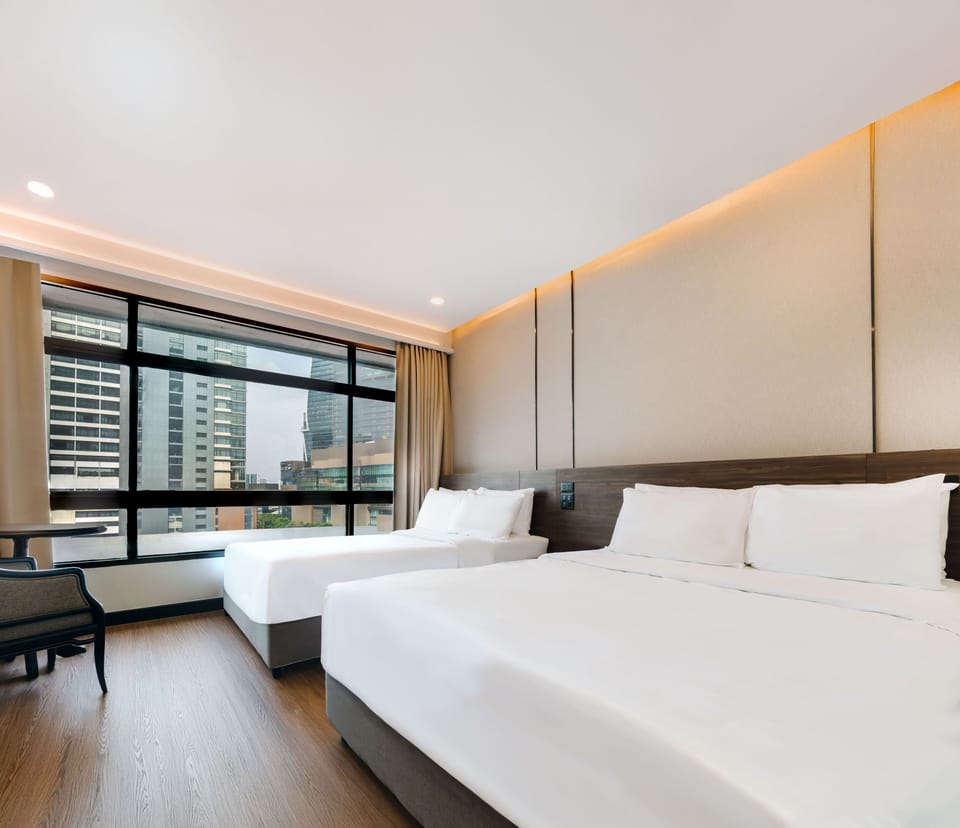 Family Room with Two Queen | Minibar, in-room safe, desk, free WiFi