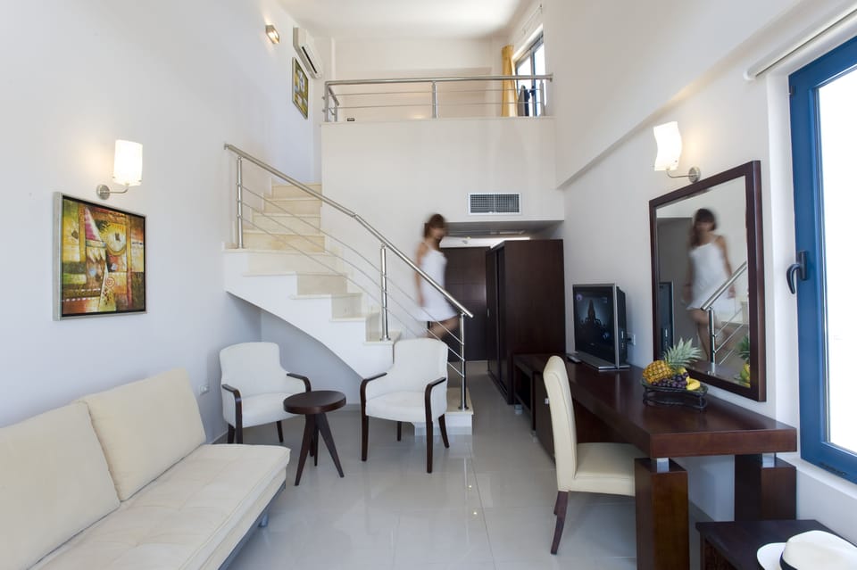 Family Room, Partial Sea View (Maisonette) | Living room | Flat-screen TV