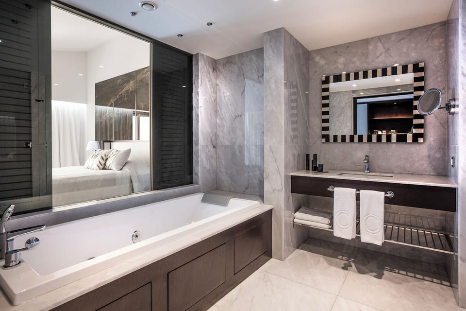 Corner Suit | Bathroom | Shower, rainfall showerhead, designer toiletries, hair dryer