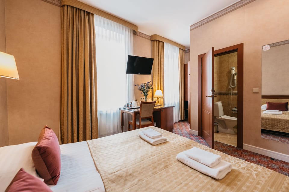 Standard Double Room | Desk, laptop workspace, blackout drapes, iron/ironing board