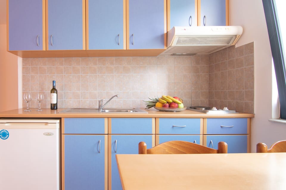 Fridge, electric kettle, dining tables