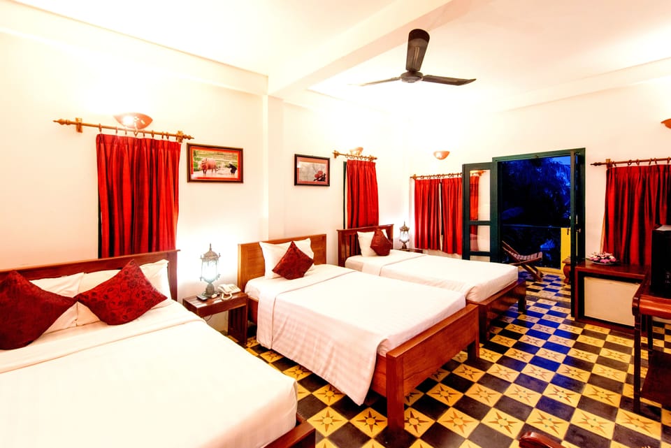 Superior Triple Room, 1 Bedroom, Garden View, Garden Area | In-room safe, individually decorated, individually furnished, desk