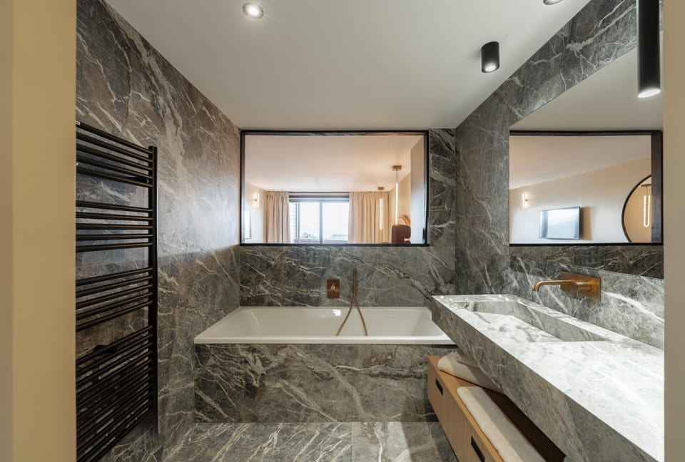Junior Suite with Balcony | Bathroom | Designer toiletries, hair dryer, bathrobes, slippers