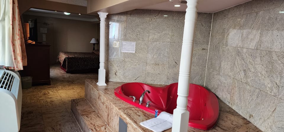 Basic Room, 1 King Bed, Jetted Tub | Select Comfort beds, iron/ironing board, free WiFi