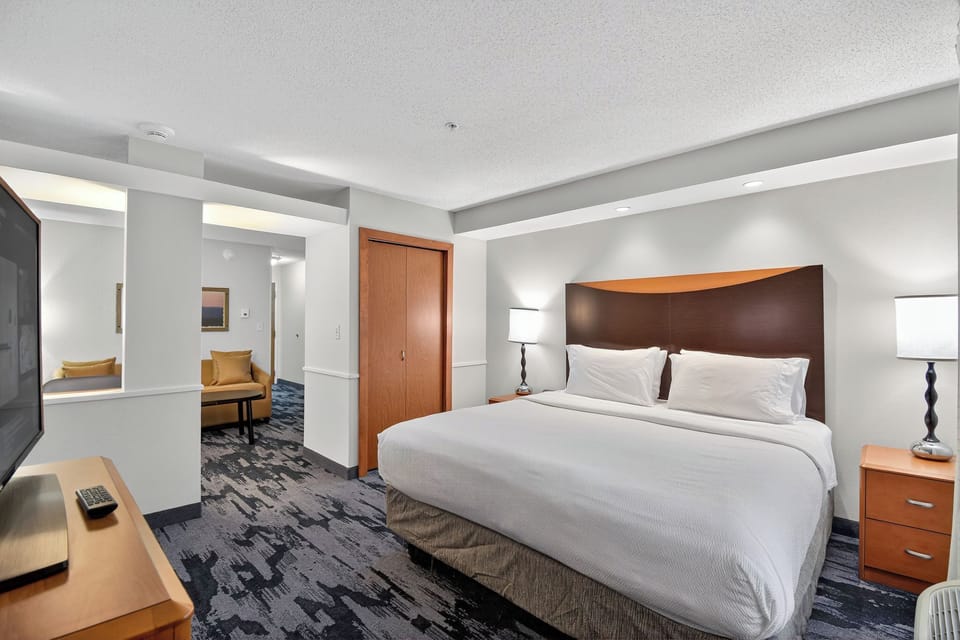 Hypo-allergenic bedding, desk, laptop workspace, blackout drapes