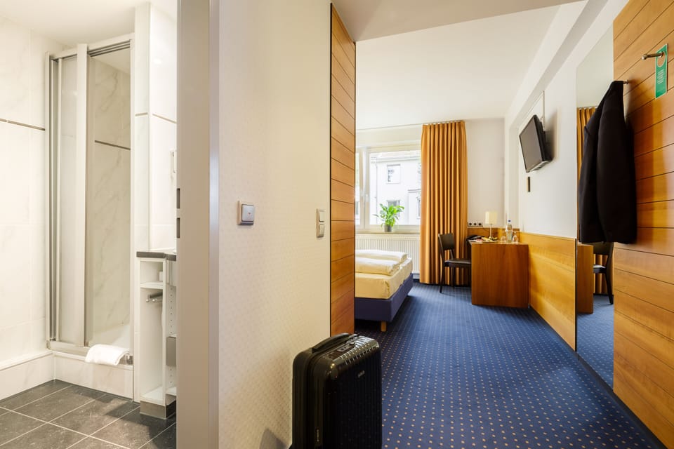 Standard Double or Twin Room | In-room safe, desk, laptop workspace, blackout drapes