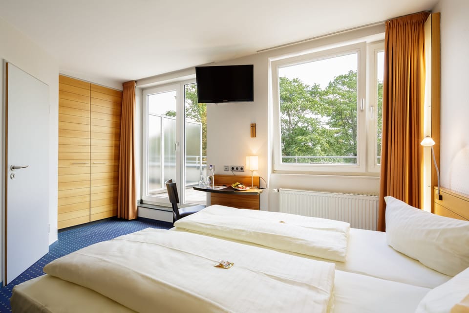 Standard Double or Twin Room, Balcony | In-room safe, desk, laptop workspace, blackout drapes