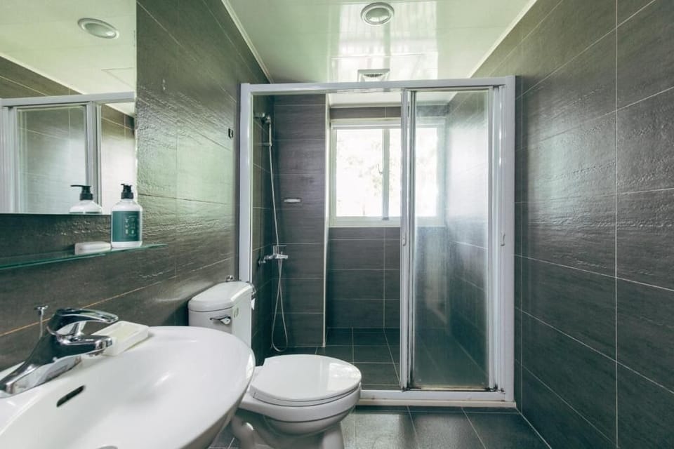 Family Room | Bathroom | Shower, hair dryer, slippers, towels