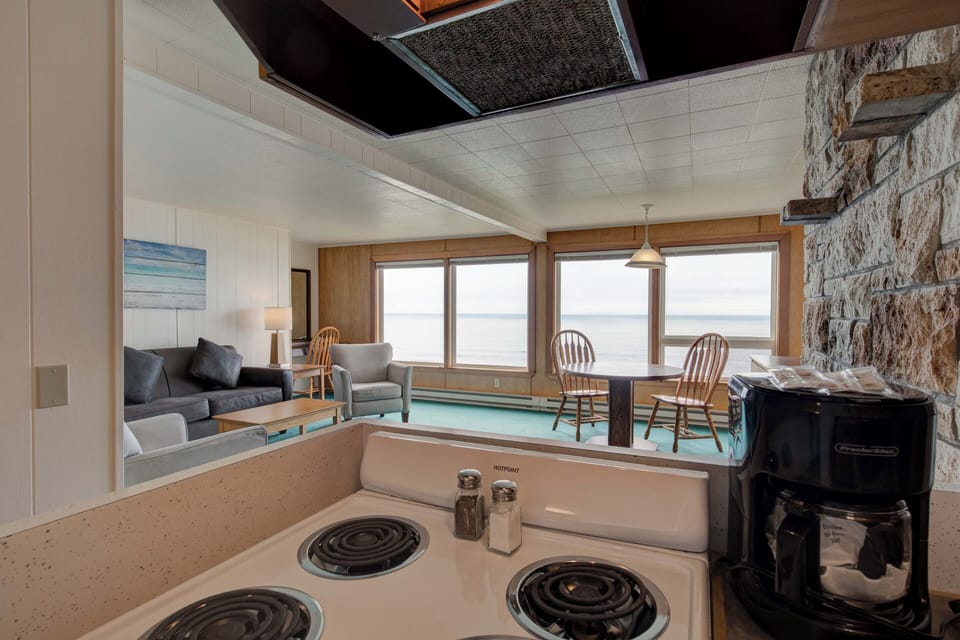1 bedroom Queen Cottage w/kitchen, Ocean Pet Friendly | Living area | 43-inch flat-screen TV with cable channels, TV, fireplace