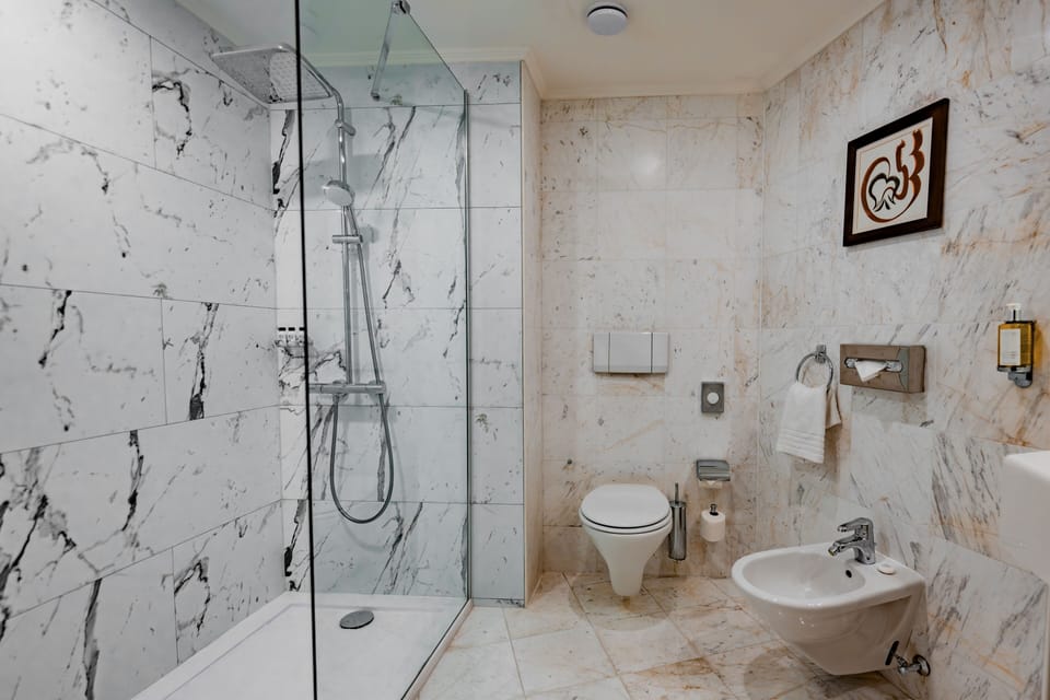 Designer toiletries, hair dryer, towels, soap