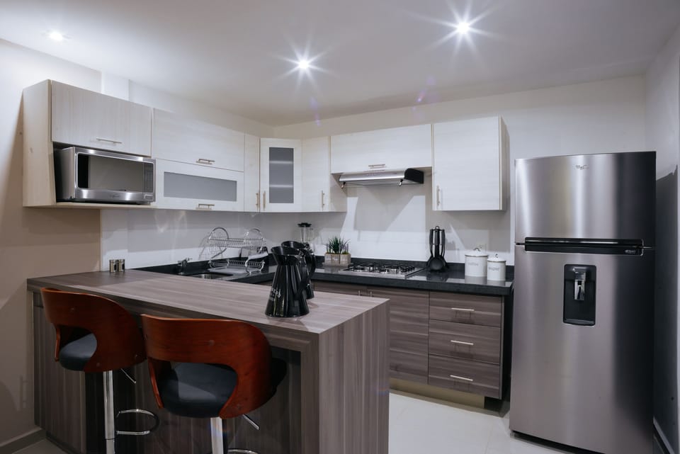 Full-size fridge, microwave, stovetop, coffee/tea maker