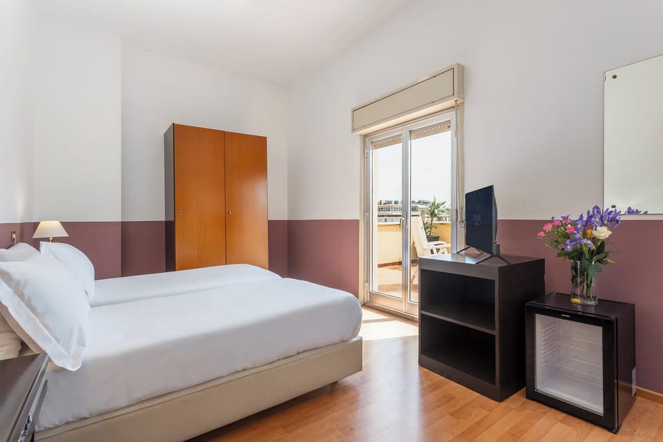 Triple Room, Terrace | Hypo-allergenic bedding, in-room safe, desk, free WiFi