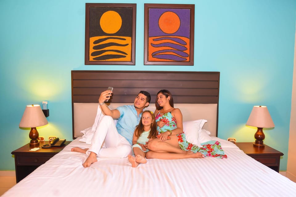 Bungalow, Oceanfront | Minibar (free items), in-room safe, desk, blackout drapes