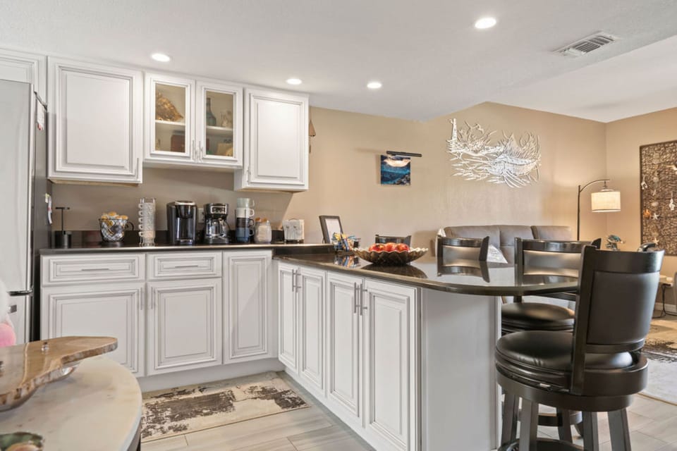 Two-Story Condo w/ Putting Green and Pool Views, Unit #210 | Private kitchen | Fridge, microwave, oven, coffee/tea maker