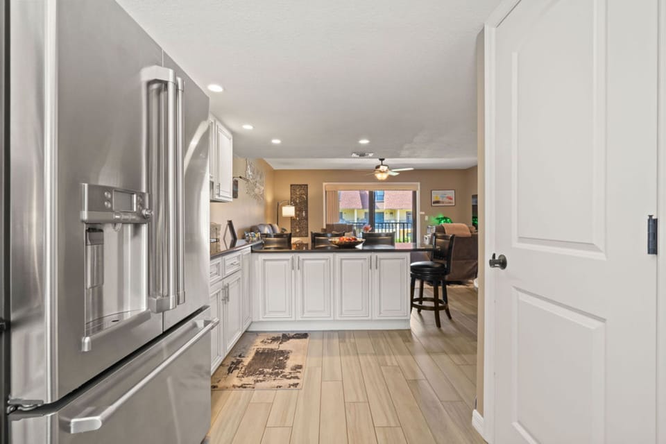 Two-Story Condo w/ Putting Green and Pool Views, Unit #210 | Private kitchen | Fridge, microwave, oven, coffee/tea maker