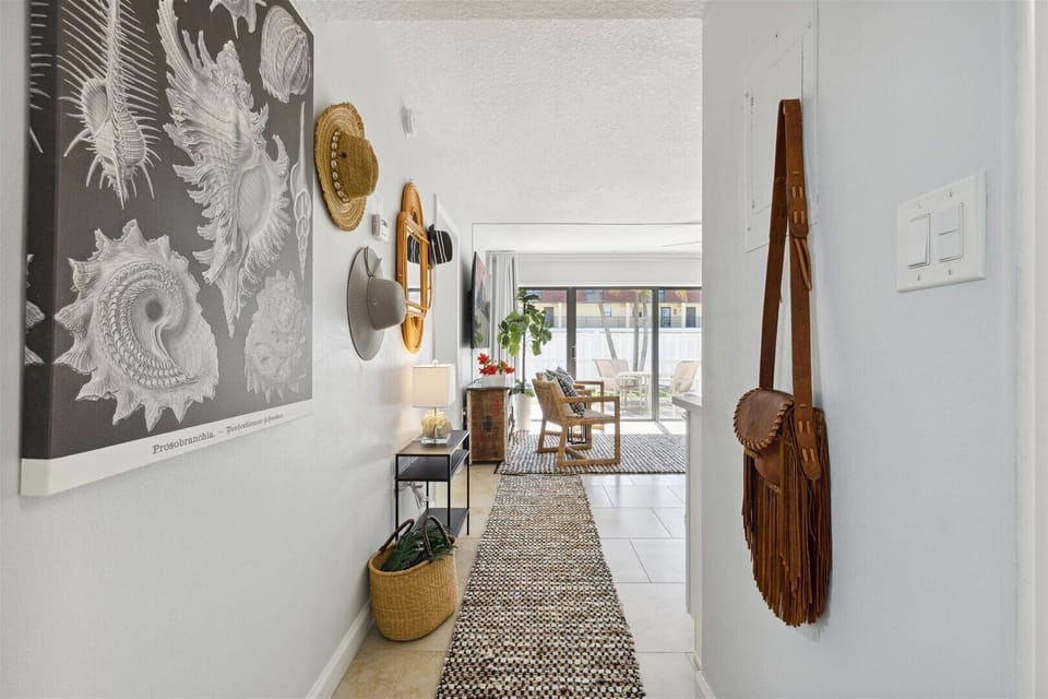 Deluxe Two-Bedroom Poolside Walkout Condo - Ground Floor - Unit #104 | Living area | Flat-screen TV