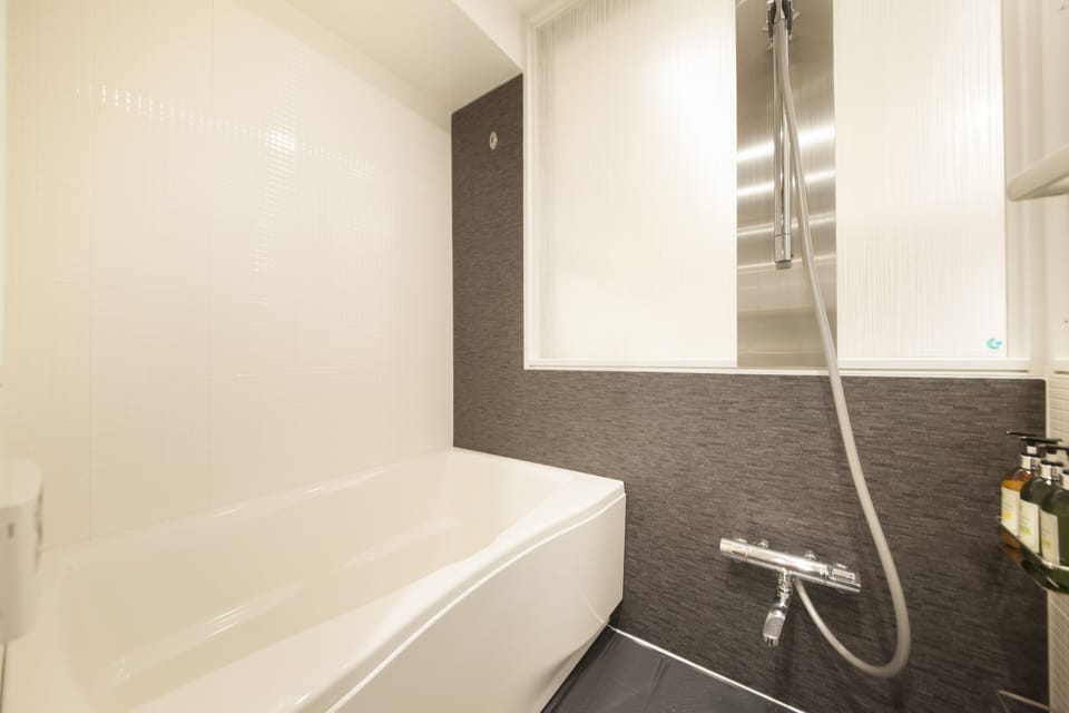 Separate tub and shower, free toiletries, hair dryer, slippers