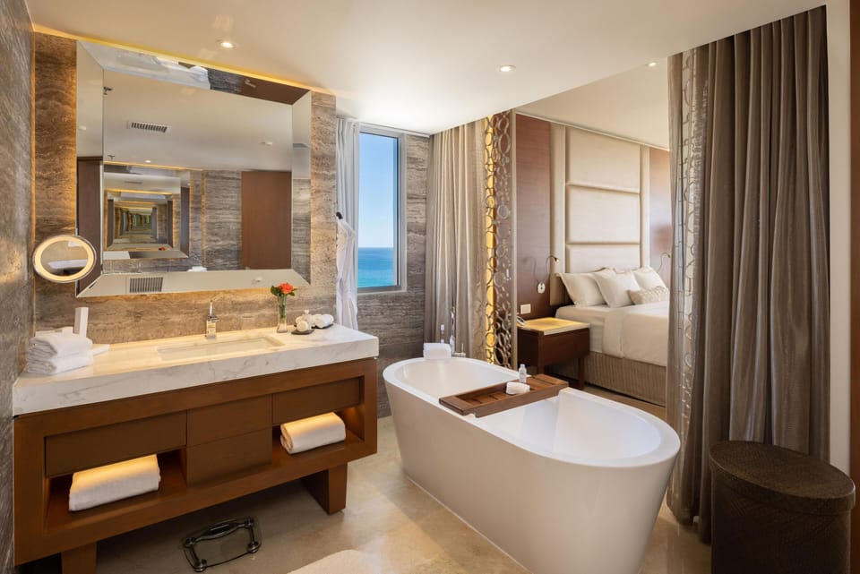 Royale Junior Suite Ocean View | Bathroom | Separate tub and shower, designer toiletries, hair dryer, bathrobes