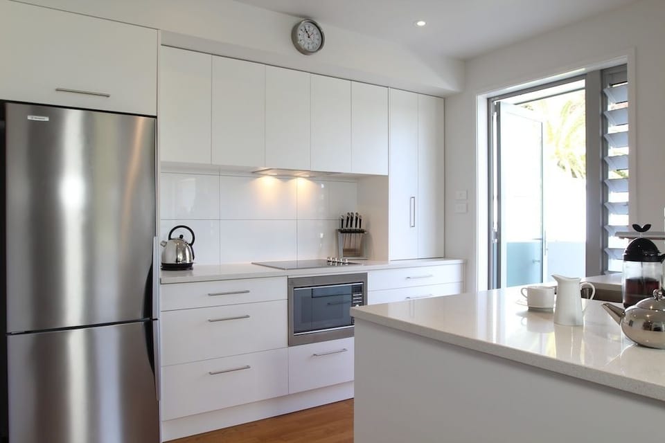 Two Bedroom Apartment | Private kitchen | Stovetop, coffee/tea maker, toaster, cookware/dishes/utensils