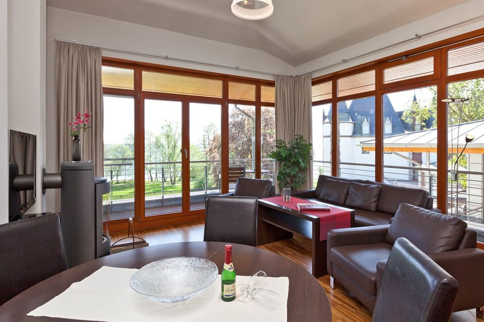 Exclusive Apartment, 2 Bedrooms, Kitchenette, Lakeside | Living room | Flat-screen TV, fireplace, heated floors