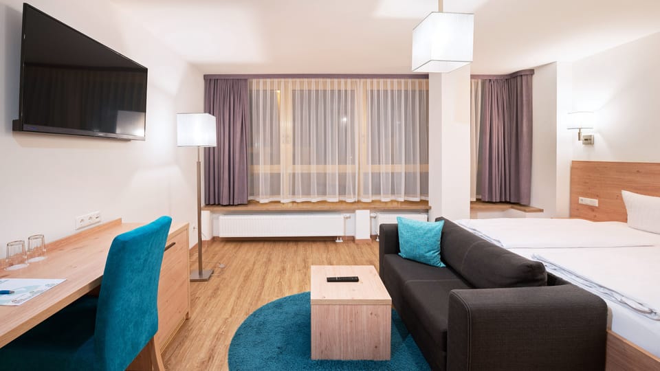 Comfort Double Room | Living area | Flat-screen TV
