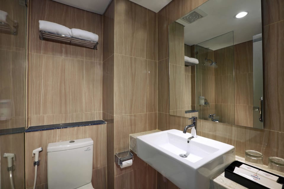 Shower, free toiletries, slippers, towels