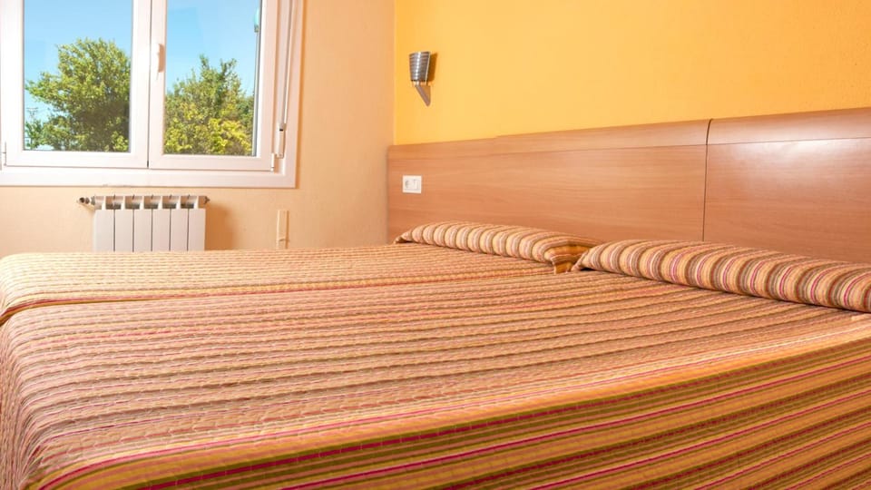 Desk, laptop workspace, free WiFi, bed sheets