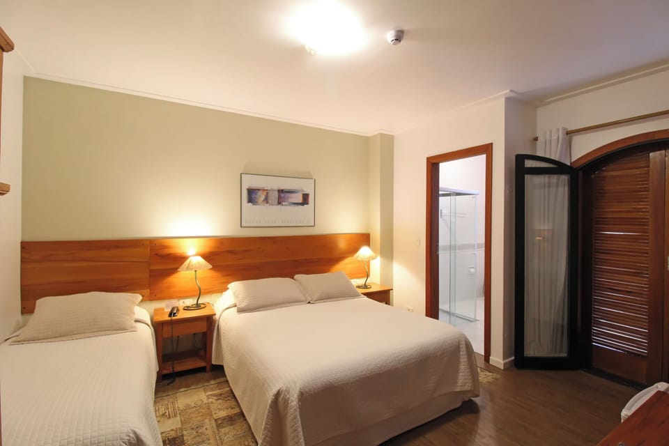 Triple Room | Minibar, in-room safe, blackout drapes, soundproofing