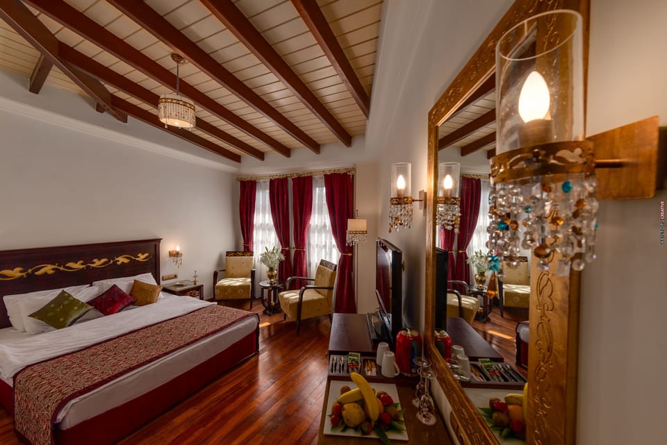 Deluxe Room, 1 King Bed | Down comforters, minibar, in-room safe, blackout drapes