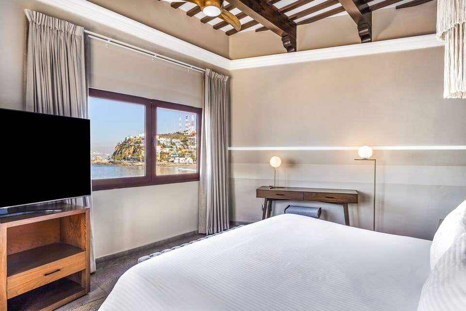 Deluxe Room, 1 King Bed, Ocean View | In-room safe, individually decorated, desk, iron/ironing board